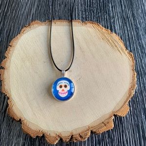 Coco handmade necklace with blue background